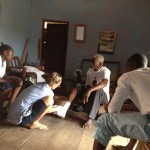 Lotte from social and health-care college in Denmark and Aalf's care givers Abigail, Henry, attending to a client.
